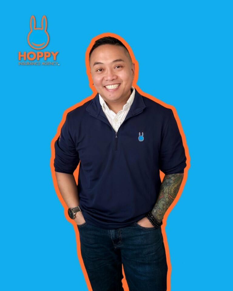 person standing up in front of blue back ground